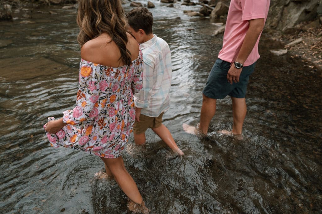 family wading in creek at big soddy gulf in soddy daisy, tn