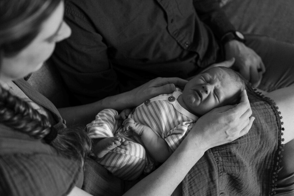 baby crying in mamas lap