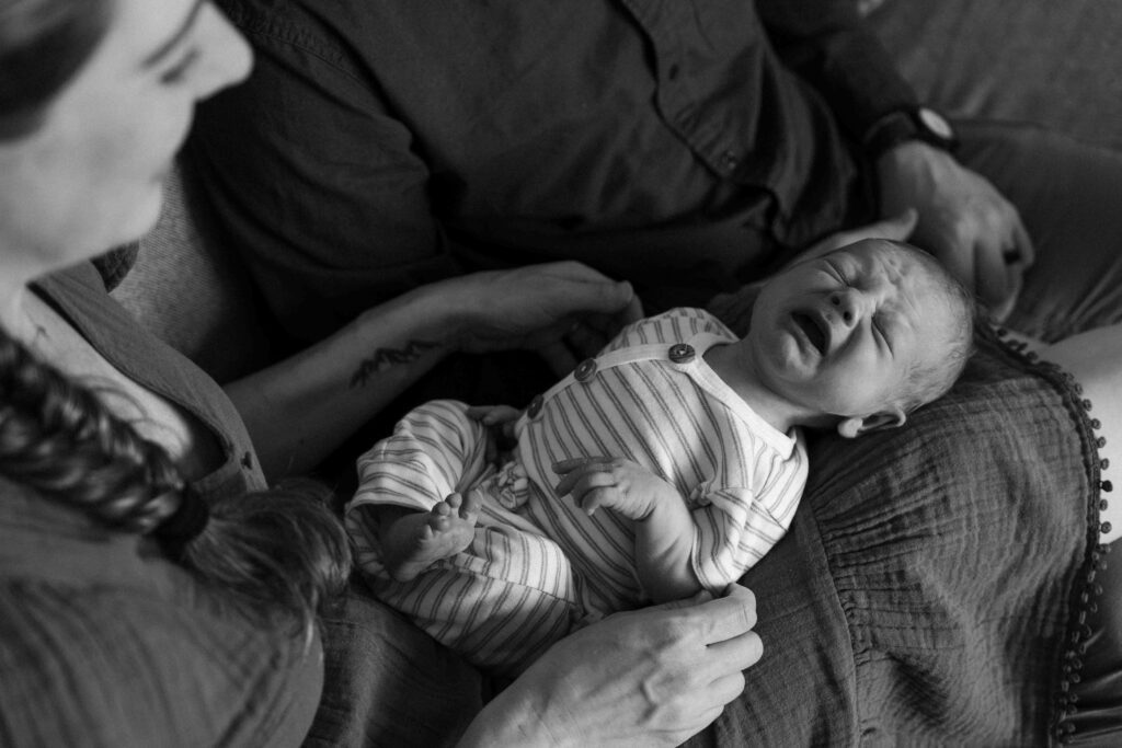 baby crying in mamas lap