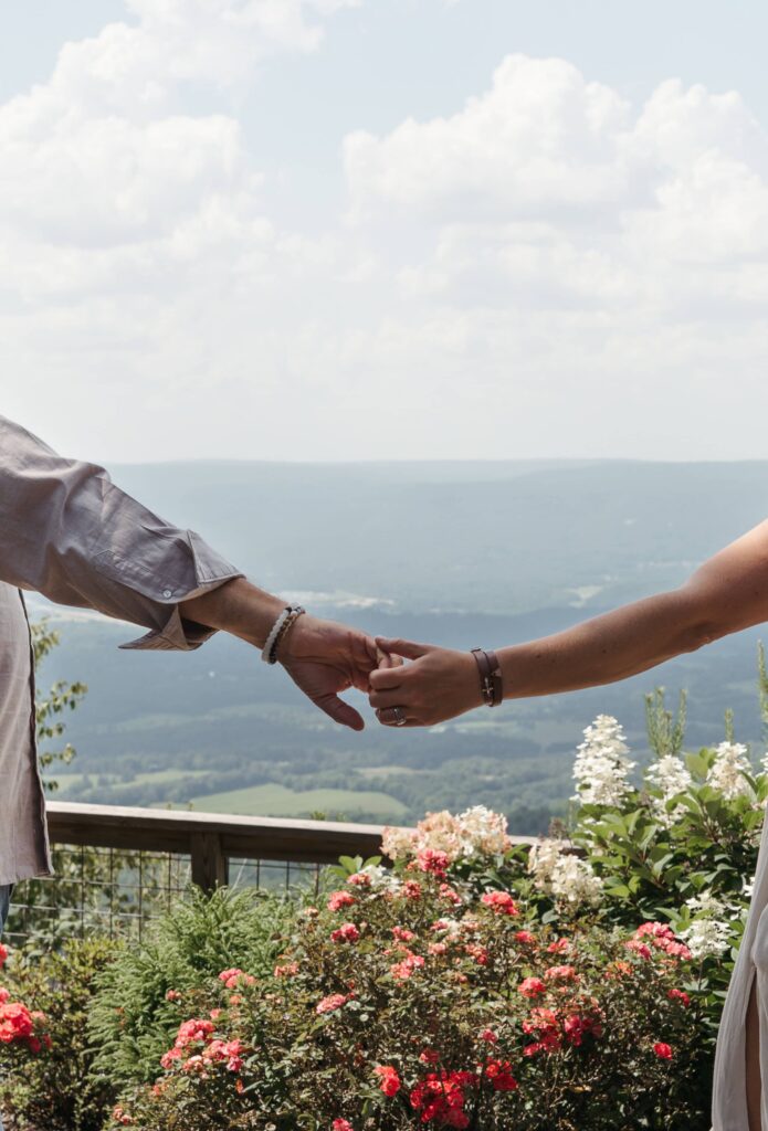 Close-up of couple holding hands overlooking Sequatchie Valley during their Chattanooga elopement